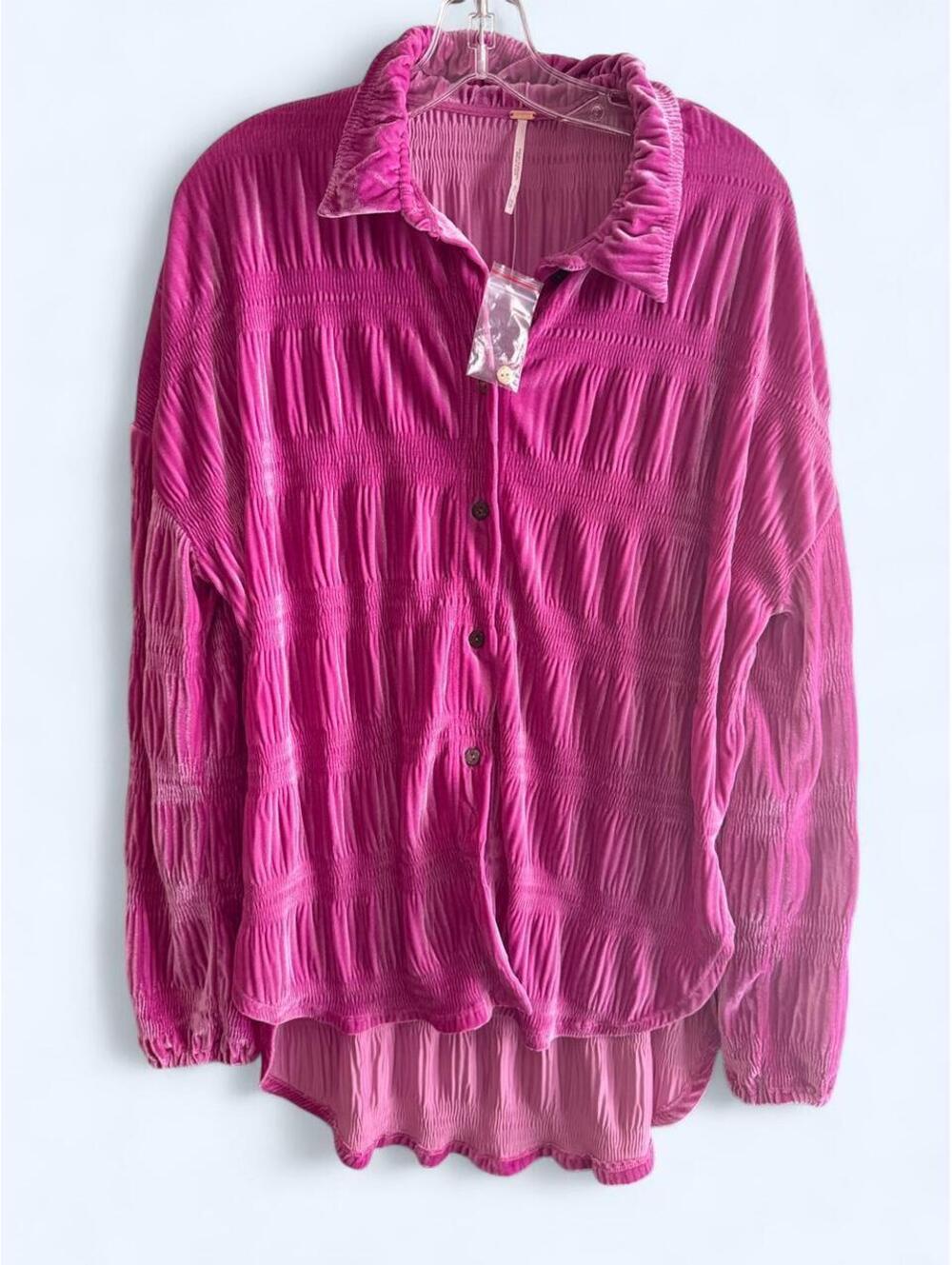 Free People pink button-up blouse with ruffled collar and cuffs